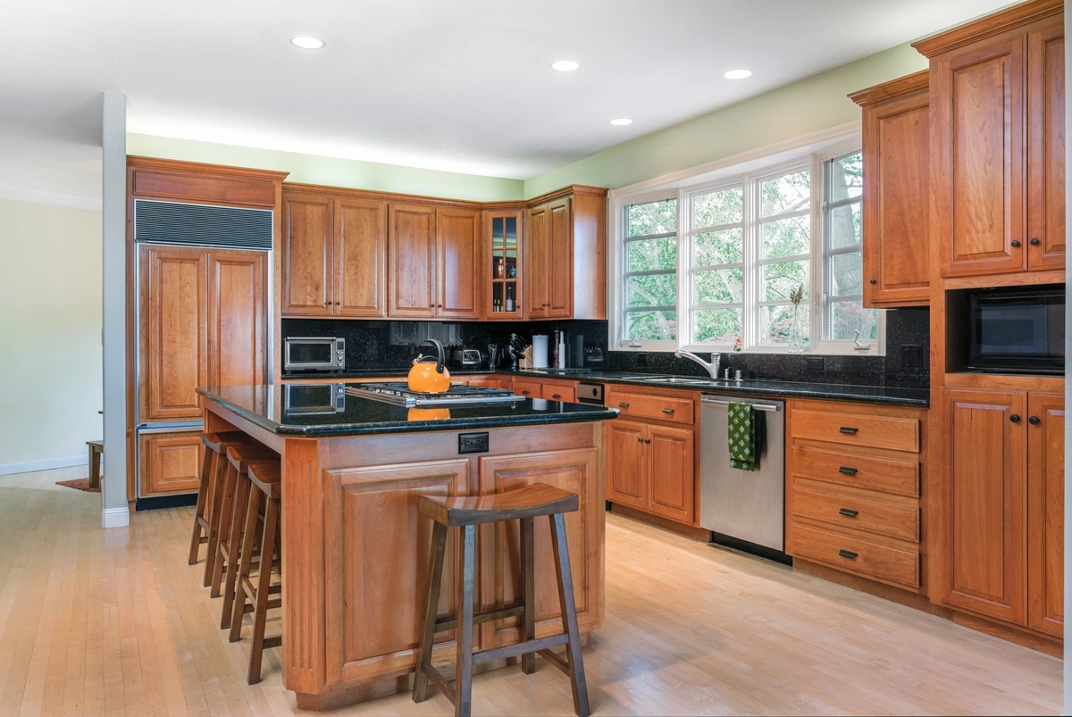 wood cabinets in traditional kitchen space